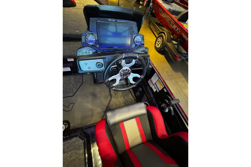Slide: The Image of 2026 Nitro Z21 XL Pro boat cockpit with steering wheel and digital display. - 6
