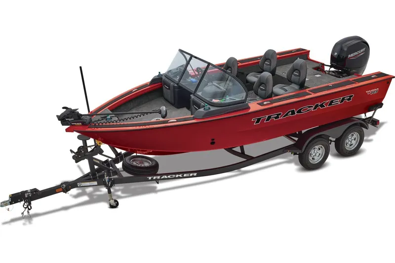 Slide: The Image of 2026 Tracker Targa V-18 WT boat, red exterior, parked near a river with bridge in background. - 9