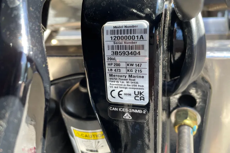 Slide: The Image of Label on Mercury Marine engine, showing model and serial numbers, for 2026 Sun Tracker Party Barge. - 102