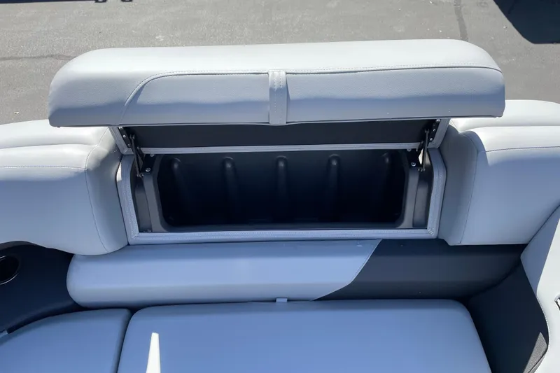 Slide: The Image of Sun Tracker Party Barge 22 RF XP3 2026, open storage compartment on boat seat. - 104