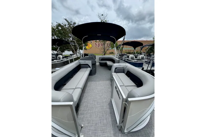 Slide: The Image of 2026 Sun Tracker Party Barge 18 DLX pontoon boat with spacious seating and canopy. - 1