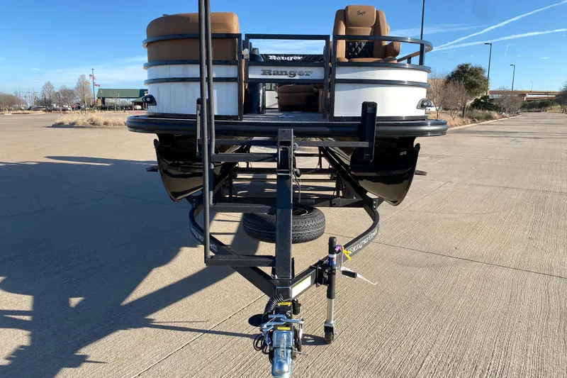 Slide: The Image of 2026 Ranger 220FC boat on trailer in parking lot, front view. - 5
