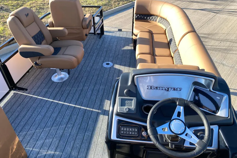 Slide: The Image of 2026 Ranger 220FC boat interior with luxurious seating and modern steering console. - 6
