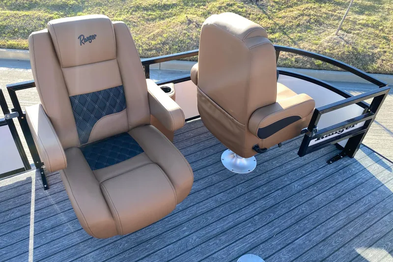 Slide: The Image of 2026 Ranger 220FC boat seats with tan leather and diamond stitching on deck. - 8