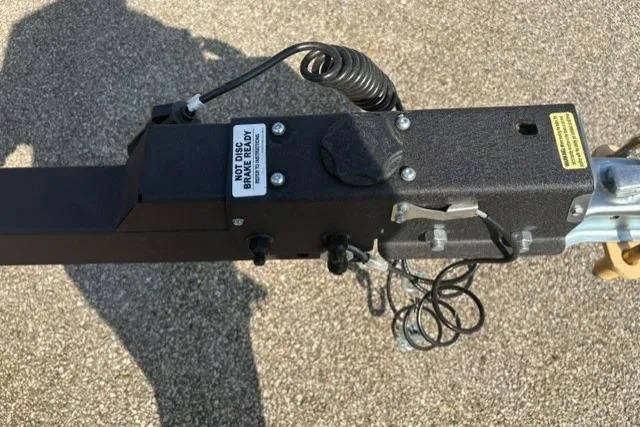 Slide: The Image of Trailer hitch mechanism of 2026 Tracker Pro Guide V-175 Combo boat. - 63