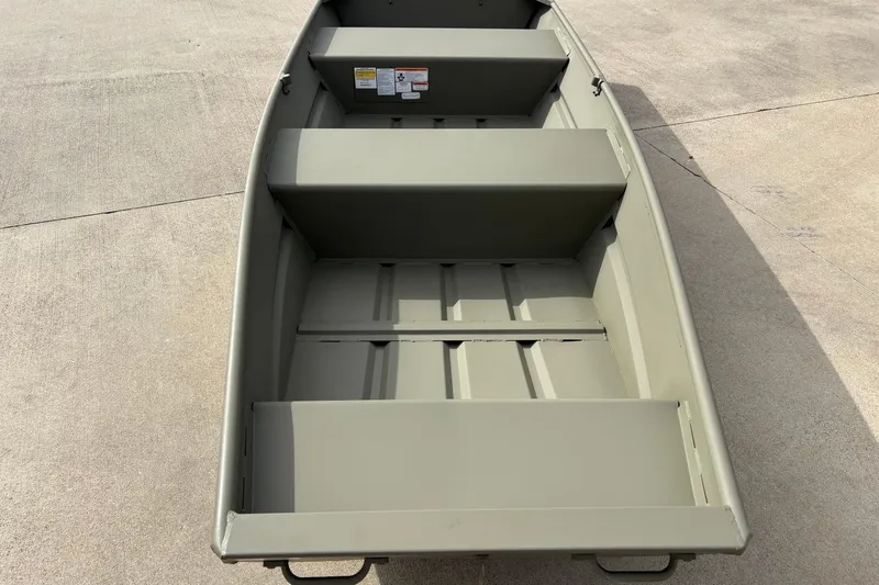 The Image of 2026 Tracker Grizzly 12 Jon boat, interior view on concrete surface. - 0