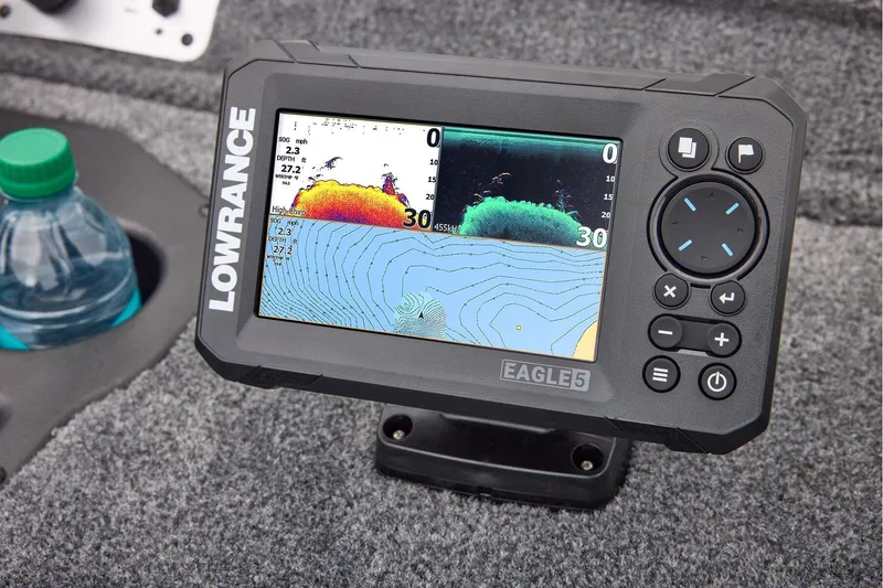 Slide: The Image of 2026 Tracker Pro Team 175 boat interior with steering wheel and control panel. - 18