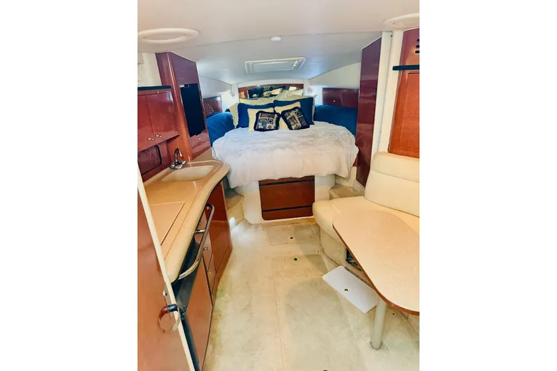 Slide: The Image of Interior of 2002 Sea Ray Sundancer 320 yacht with cozy bed and kitchenette. - 20