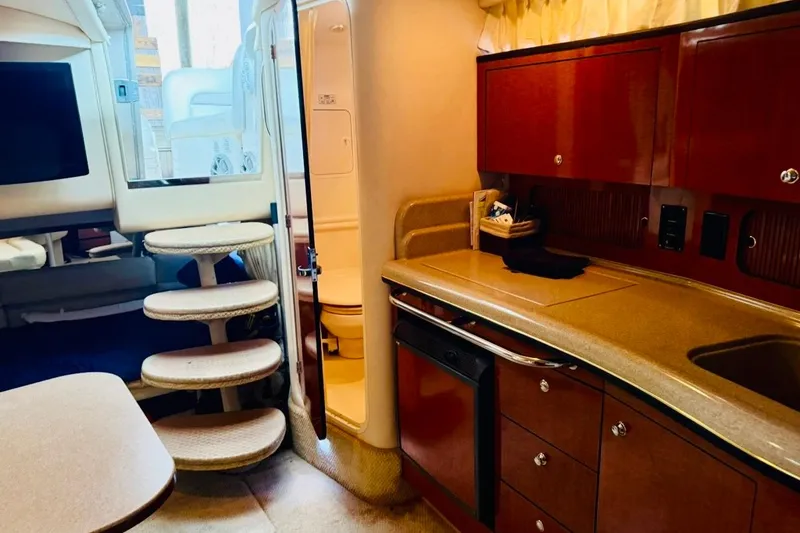 Slide: The Image of Interior of 2002 Sea Ray Sundancer 320 yacht with kitchen and stairs. - 23