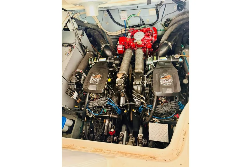 Slide: The Image of Engine compartment of a 2002 Sea Ray Sundancer 320 boat, showcasing dual engines. - 24