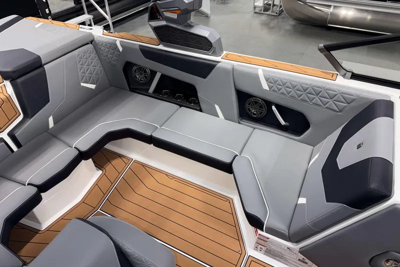 Slide: The Image of 2026 Nautique Super Air Nautique GS20 interior with sleek gray seating and modern design. - 11
