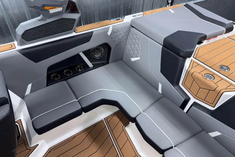 Slide: The Image of 2026 Nautique Super Air Nautique GS20 interior with sleek gray seating and modern design. - 12