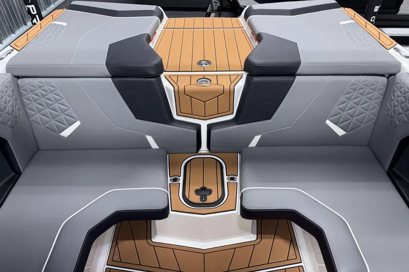 Slide: The Image of 2026 Nautique Super Air Nautique GS20 interior with sleek gray and tan seating design. - 14