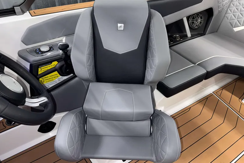 Slide: The Image of 2026 Nautique Super Air Nautique GS20 interior with sleek gray seating and modern controls. - 16