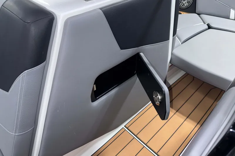 Slide: The Image of 2026 Nautique Super Air Nautique GS20 interior with sleek seating and storage compartment. - 22