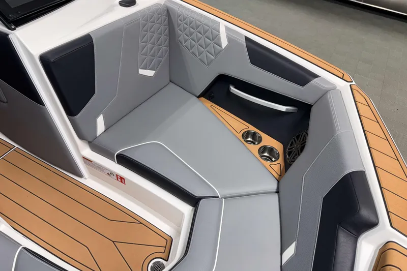Slide: The Image of 2026 Nautique Super Air Nautique GS20 interior with sleek seating and cup holders. - 28