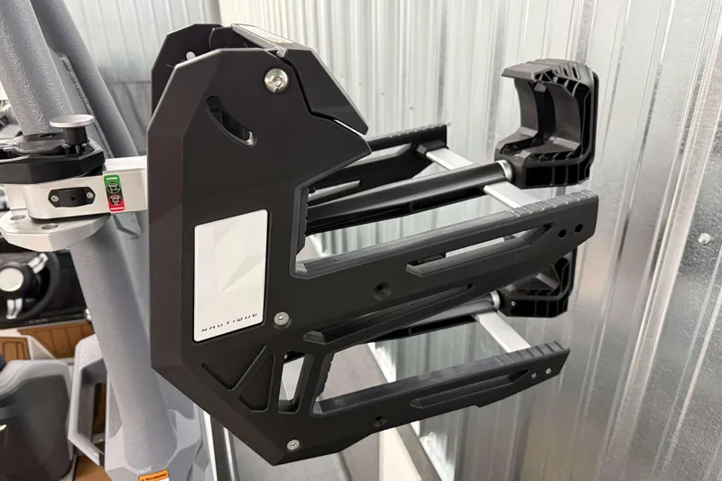 Slide: The Image of 2026 Nautique Super Air Nautique GS20 wakeboard rack, black and silver, mounted on boat. - 32