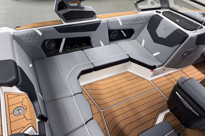 Slide: The Image of 2026 Nautique Super Air Nautique GS20 interior with sleek gray seating and teak-style flooring. - 9