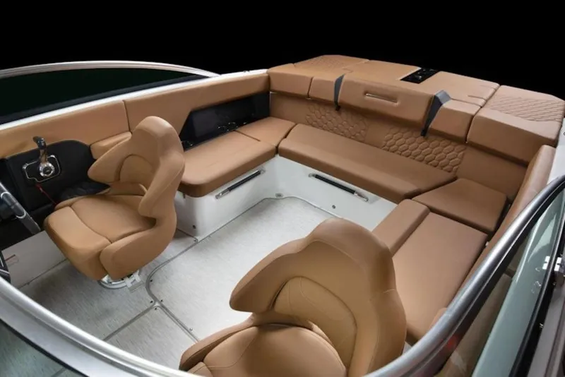 Slide: The Image of 2026 Four Winns H4 boat interior with luxurious tan seating and modern design. - 12