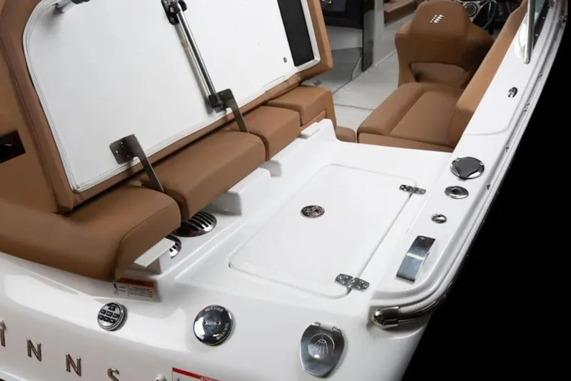 Slide: The Image of 2026 Four Winns H4 boat interior with brown seating and white deck features. - 13