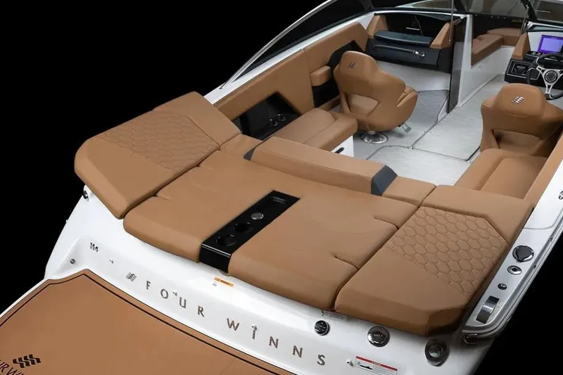Slide: The Image of 2026 Four Winns H4 boat interior with tan seating and sleek design. - 2