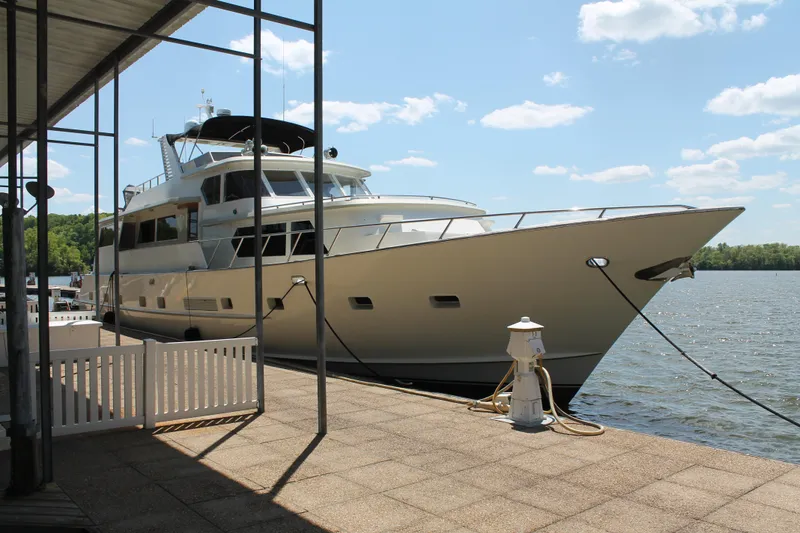 Slide: The Image of 1984 Broward CPMY yacht docked on a sunny day. - 11