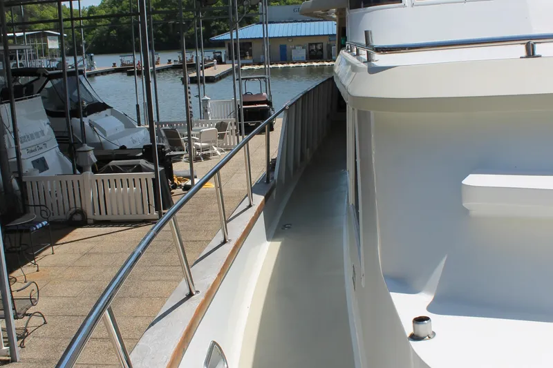 Slide: The Image of 1984 Broward CPMY yacht docked, side view. - 22