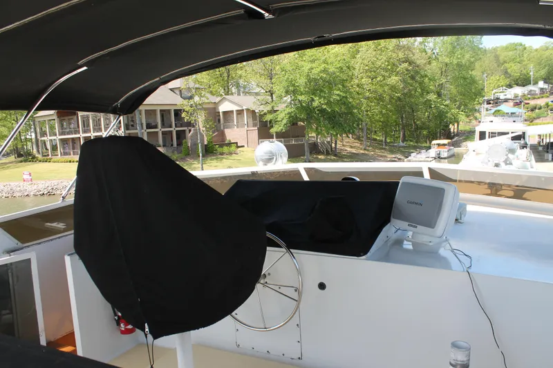 Slide: The Image of 1984 Broward CPMY Raised Pilothouse with covered helm station. - 29