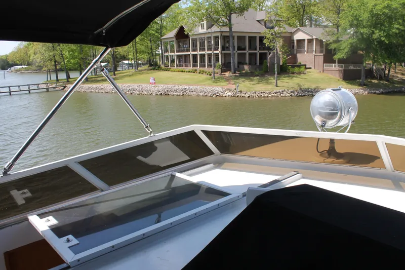 Slide: The Image of View from a 1984 Broward CPMY of a lakeside house. - 31