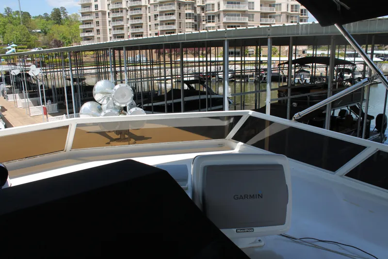 Slide: The Image of 1984 Broward CPMY yacht with Garmin navigation system in marina. - 32