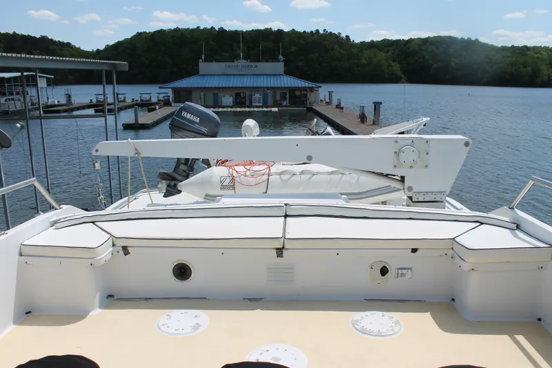 Slide: The Image of 1984 Broward CPMY yacht docked with scenic water view. - 36