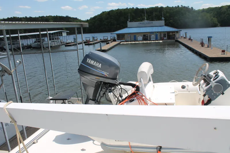 Slide: The Image of Yamaha outboard motor on a boat, view of the marina. - 37