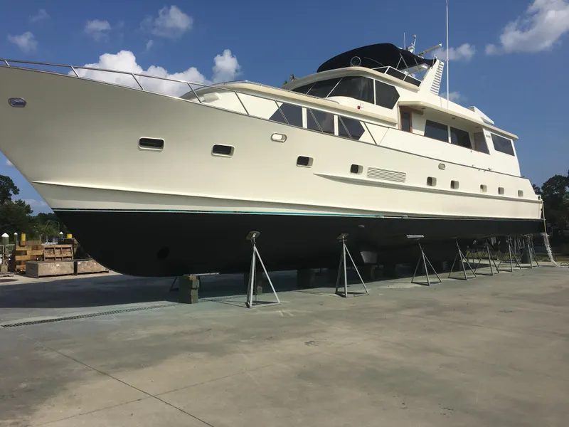 Slide: The Image of 1984 Broward CPMY Raised Pilothouse yacht on dry dock. - 7