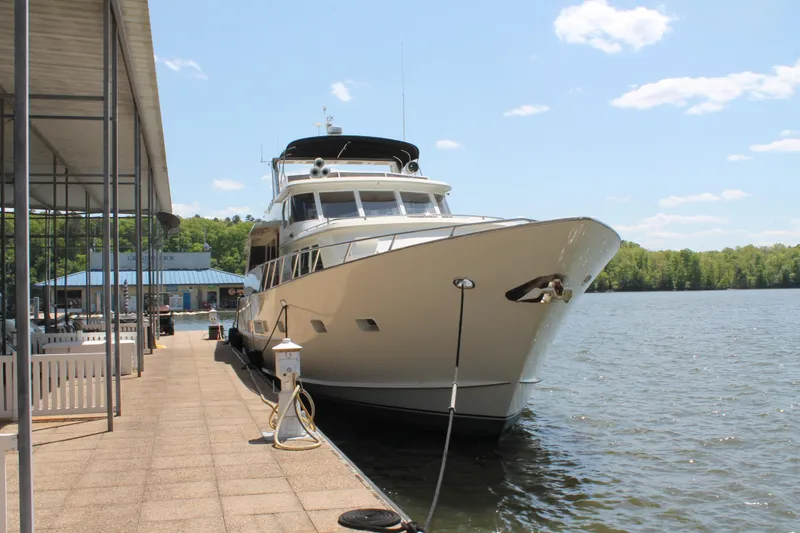 Slide: The Image of 1984 Broward CPMY yacht docked on a sunny day. - 9