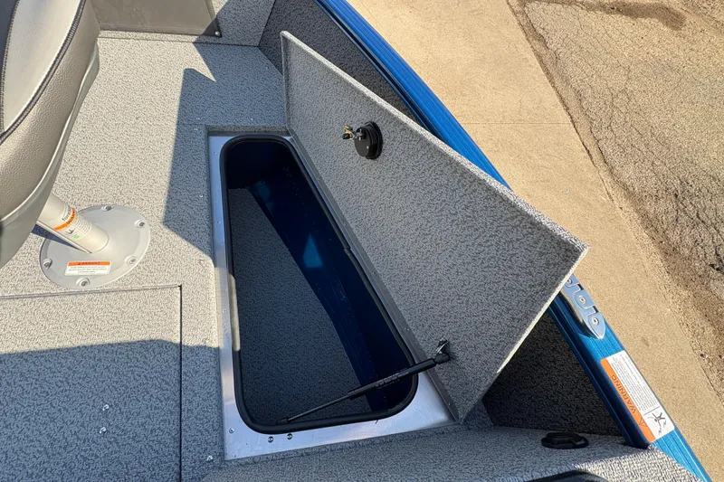 Slide: The Image of 2026 Lund 1775 Adventure SS boat with open storage compartment and seating. - 12