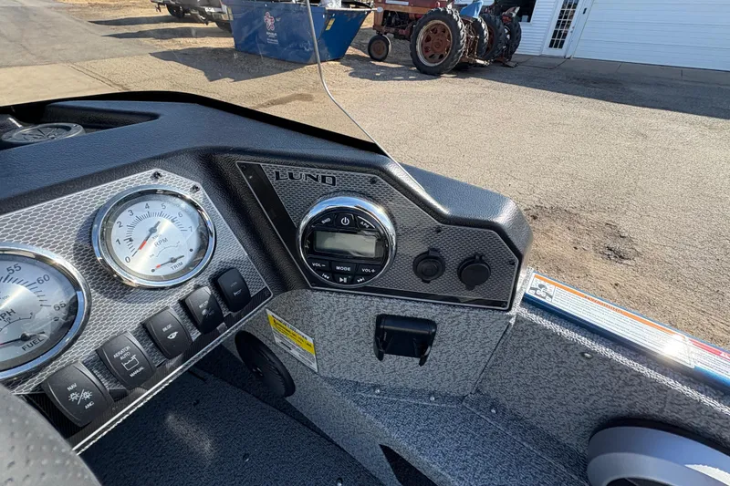 Slide: The Image of Dashboard of 2026 Lund 1775 Adventure SS boat with gauges and controls. - 17