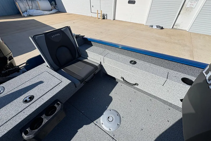Slide: The Image of 2026 Lund 1775 Adventure SS boat interior with seating and storage compartments. - 20