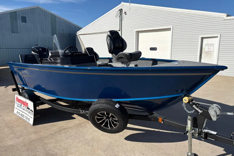 Slide: The Image of 2026 Lund 1775 Adventure SS boat on trailer, displayed outdoors. - 7