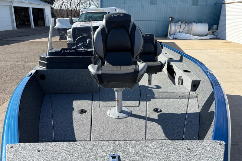 Slide: The Image of 2026 Lund 1775 Adventure SS boat interior with seating and steering console. - 8