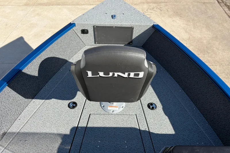 Slide: The Image of 2026 Lund 1775 Adventure SS boat interior with branded seat and gray flooring. - 9