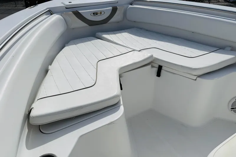 Slide: The Image of Sea Hunt Ultra 211 boat with Yamaha 150 engine on open water, 2012 model. - 11