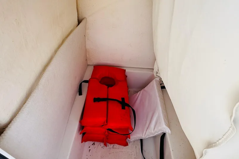 Slide: The Image of 2012 Sea Hunt Ultra 211 boat with Yamaha outboard motor, parked on a trailer. - 13