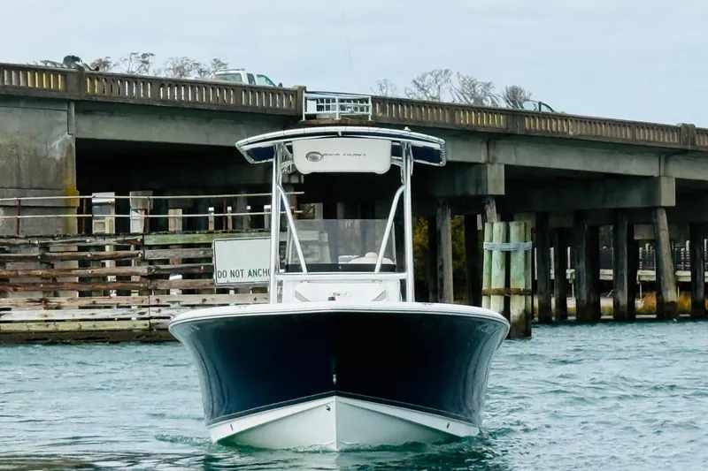 Slide: The Image of 2012 Sea Hunt Ultra 211 boat interior with open water and bridge in background. - 4
