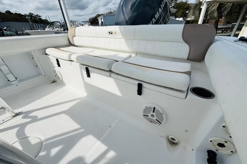 Slide: The Image of 2012 Sea Hunt Ultra 211 boat seat with white upholstery and SH logo. - 8