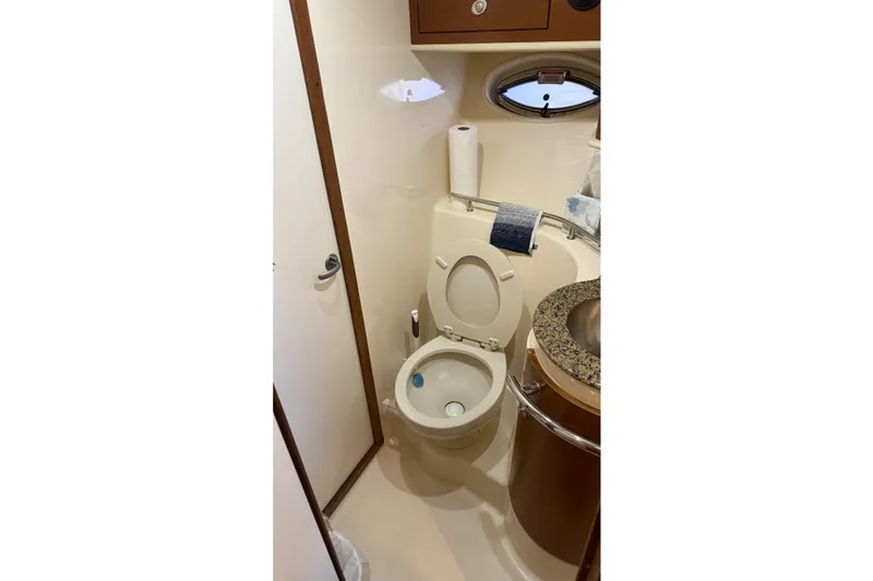 Slide: The Image of Bathroom interior of 2007 Sea Ray Sundancer 400 yacht, featuring toilet and sink. - 19