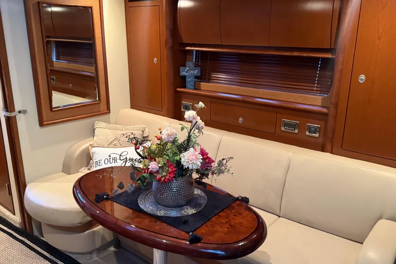Slide: The Image of Luxurious interior of 2007 Sea Ray Sundancer 400 with elegant seating and floral centerpiece. - 23