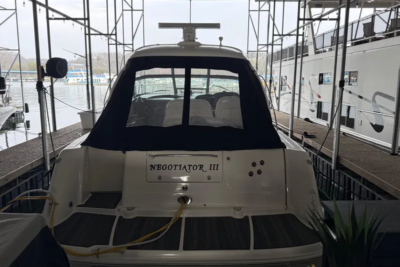 Slide: The Image of 2007 Sea Ray Sundancer 400 docked, rear view with "Negotiator III" nameplate. - 4