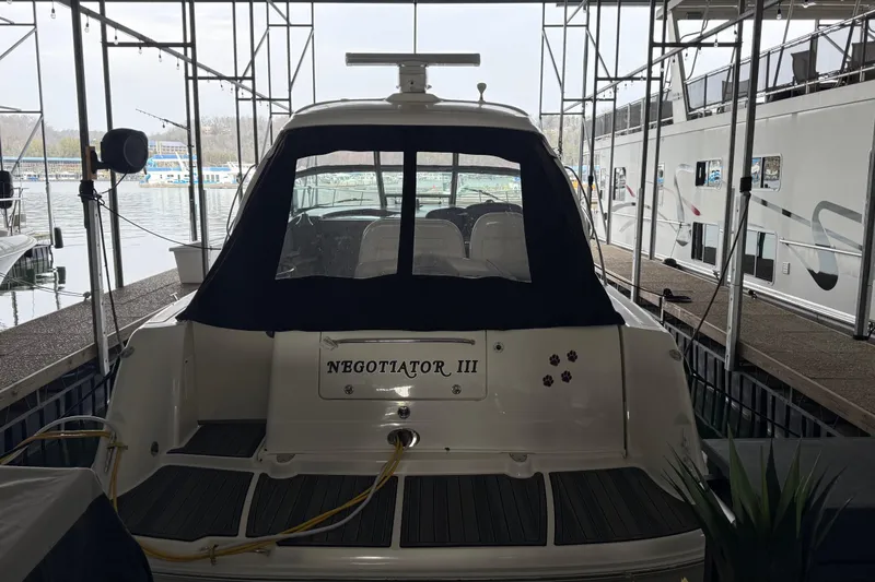 Slide: The Image of 2007 Sea Ray Sundancer 400 docked, rear view with "Negotiator III" nameplate. - 5
