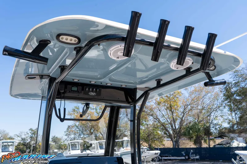 Slide: The Image of 2023 Sea Hunt Ultra 255 SE boat with rod holders and electronics on the T-top. - 20