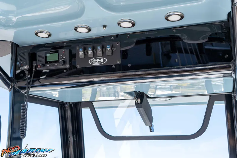 Slide: The Image of 2023 Sea Hunt Ultra 255 SE boat console with Garmin radio and control panel. - 22
